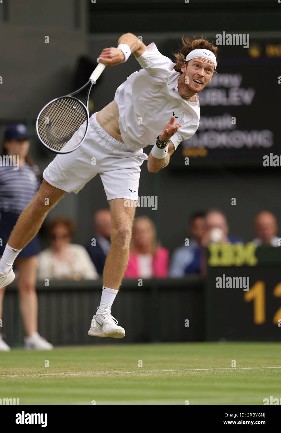 Andrey Rublev of Russia hits a ball during the Gentlemens Singles Quarter-finals match against Novak Djokovic of Serbia in the Championships, Wimbledon at All England Lawn Tennis and Croquet Club in London,