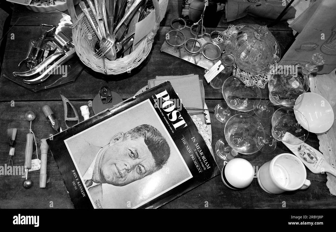 Vintage items for sale in an American antique shop include a 1964 issue