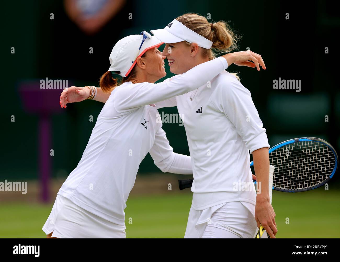 Caroline Wozniacki (right) and Cara Black celebrate winning their