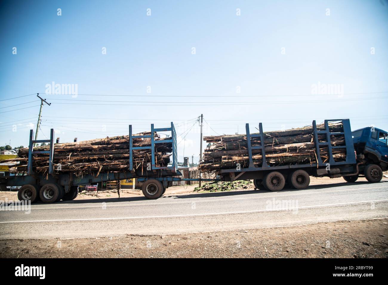 Nakuru, Kenya. 11th July, 2023. A stalled truck transporting wood logs seen on a highway in Elburgon near Nakuru City. Early this month, William Ruto, The President of Kenya announced the lifting of a six-year-long ban on tree harvesting from public and community forests, a move that has raised uproar from environmental groups warning of potential long term consequences on the environment. (Credit Image: © James Wakibia/SOPA Images via ZUMA Press Wire) EDITORIAL USAGE ONLY! Not for Commercial USAGE! Stock Photo
