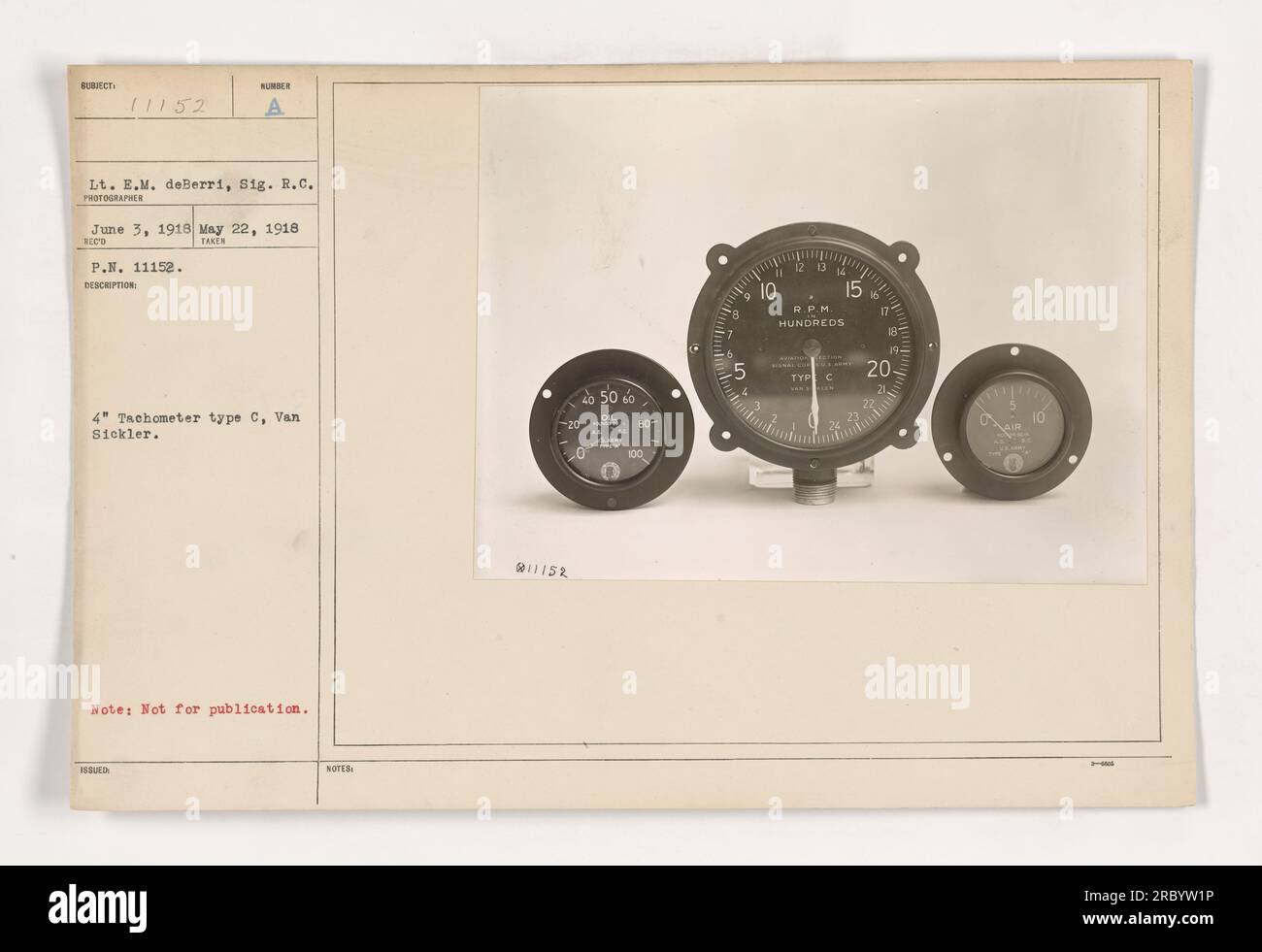 Soldiers using Tachometer type C by Van Sickler on May 22, 1918. Lt. E.M. deBerri from the Signal Corps took this photo on June 3, 1918. The photo has a number of 11152 and is marked 'Not for publication.' The tachometer's RPM ranges from 20 to 60. Stock Photo