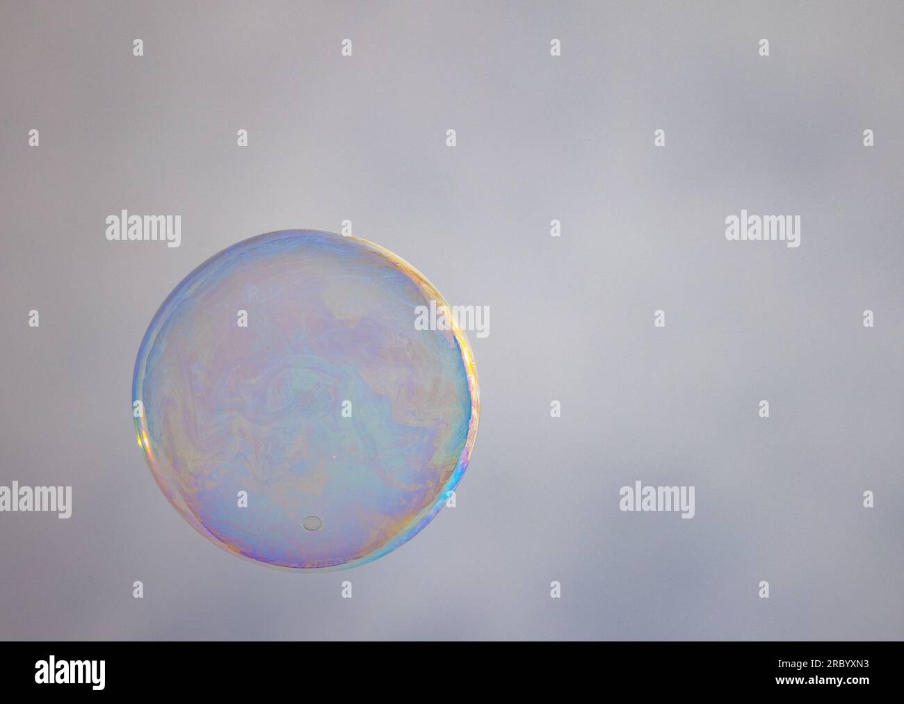 A large soap bubble showing all rainbow colors due to diffraction of