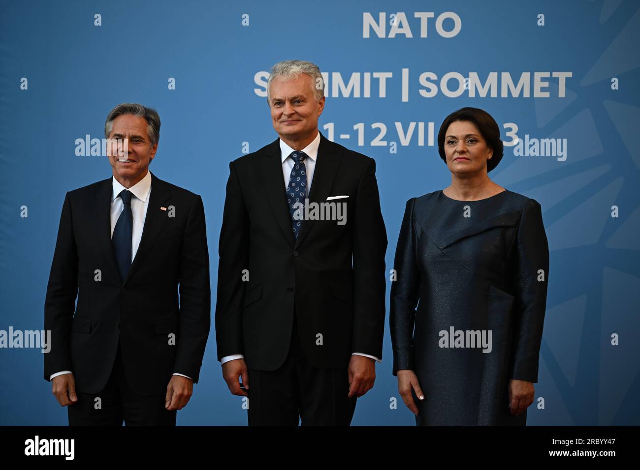 US Secretary of State Antony Blinken (left), is greeted by Lithuania's President Gitanas Nauseda and his wife Diana Nausediene for the social dinner during the Nato summit in Vilnius, Lithuania. Picture date: Tuesday July 11, 2023. Stock Photo