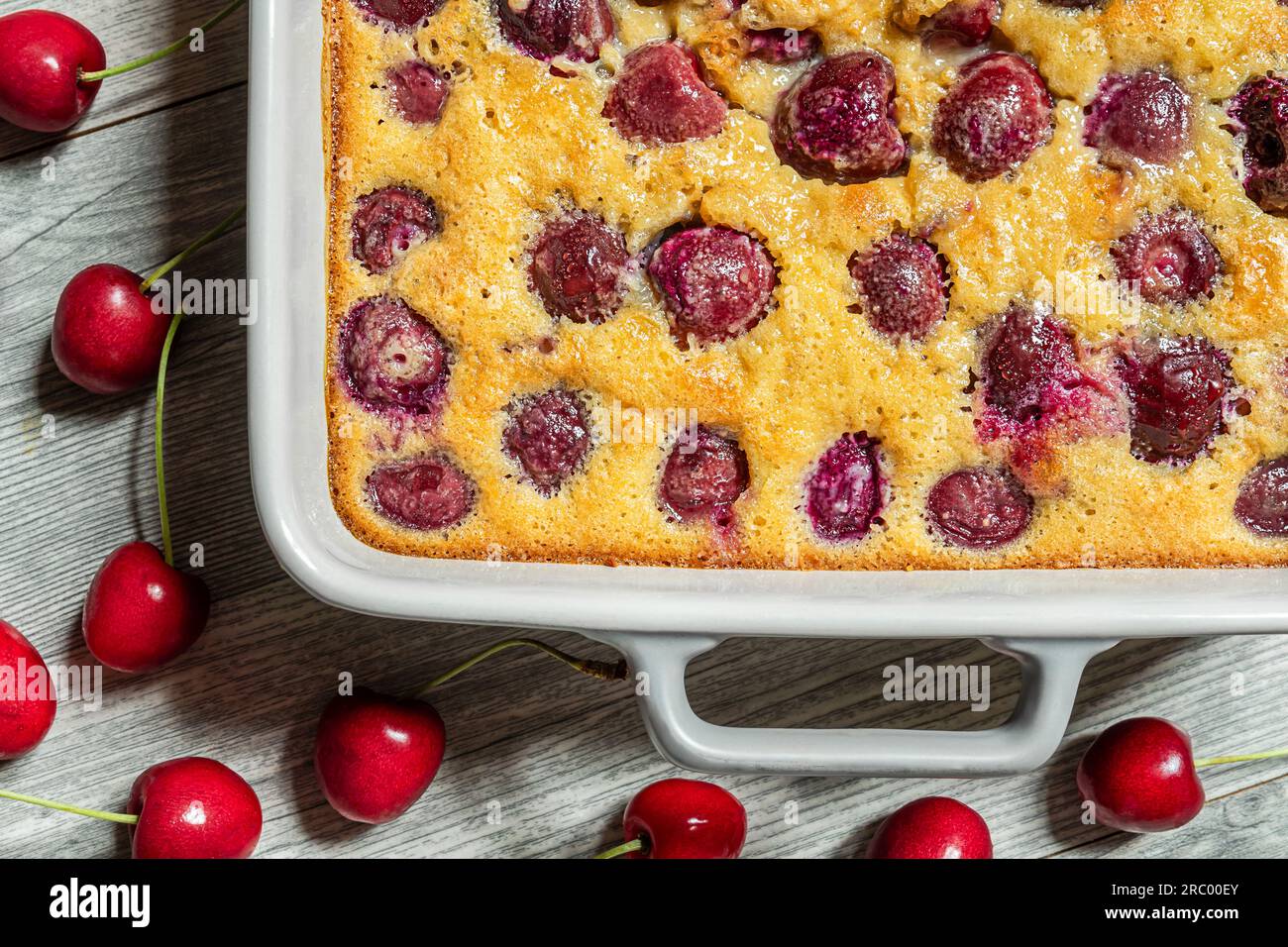 Clafoutis cherry tart - traditional french pie in a baking dish, top view Stock Photo