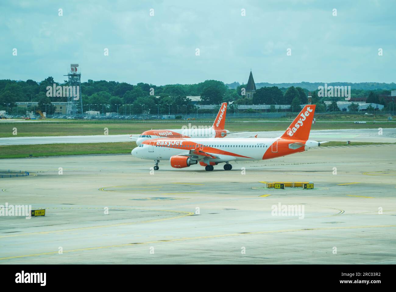 London UK. 11 July 2023   Easyjet aircraft on the runway at Gatwick airport. The low budget airline  EasyJet  has cancelled 1,700 summer flights for July August and September affecting  180,000 passengers which has been  blamed on air-traffic control delays in Europe. Credit amer ghazzal/Alamy Live News Stock Photo