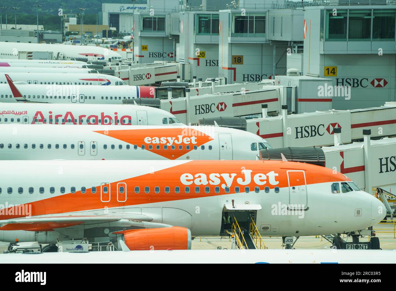 London UK. 11 July 2023   Easyjet aircrafts parked at a gate at Gatwick airport. The low budget airline  EasyJet  has cancelled 1,700 summer flights for July August and September affecting  180,000 passengers which has been  blamed on air-traffic control delays in Europe. Credit amer ghazzal/Alamy Live News Stock Photo