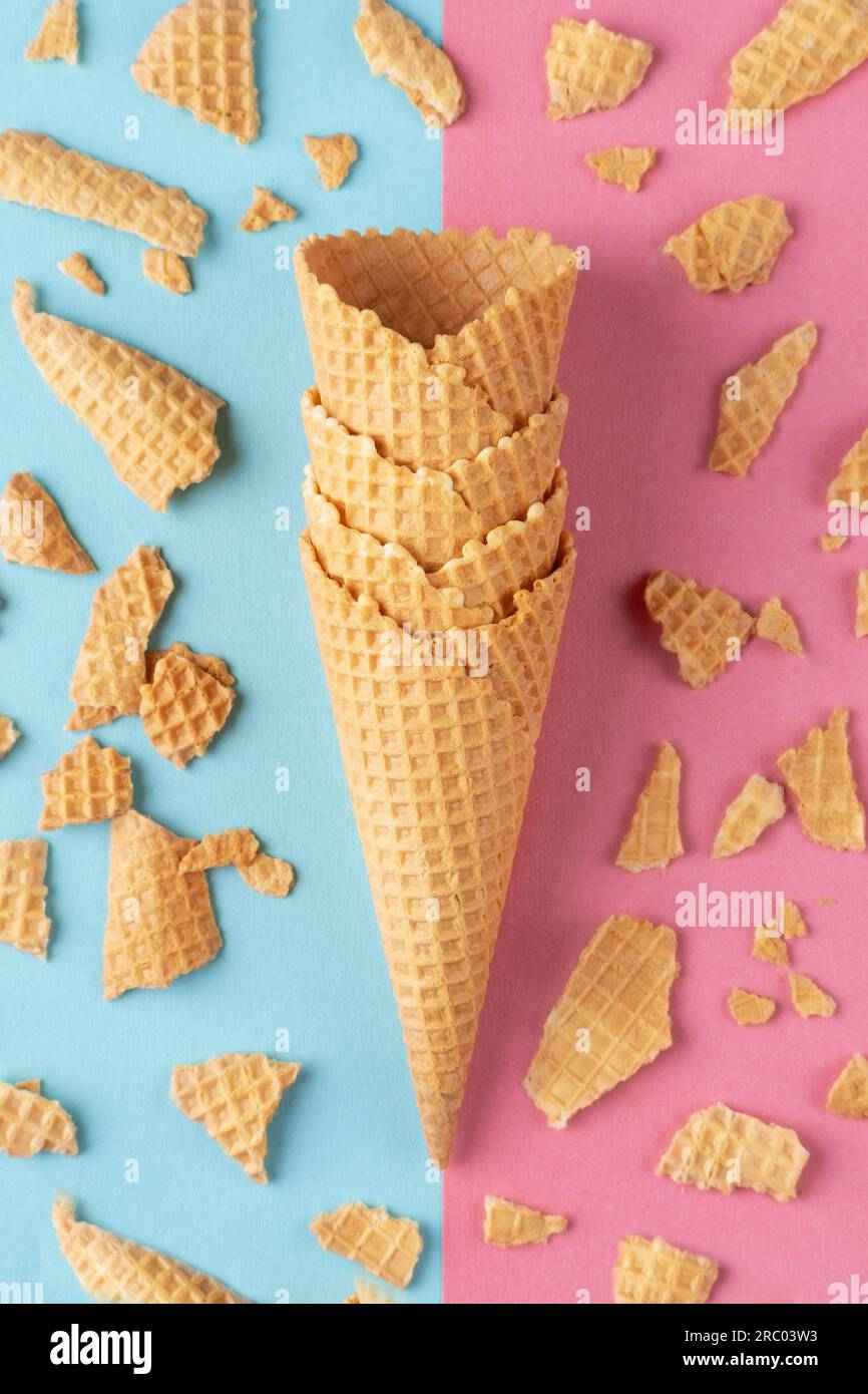 Ice cream waffle cones on pink and blue background Stock Photo - Alamy