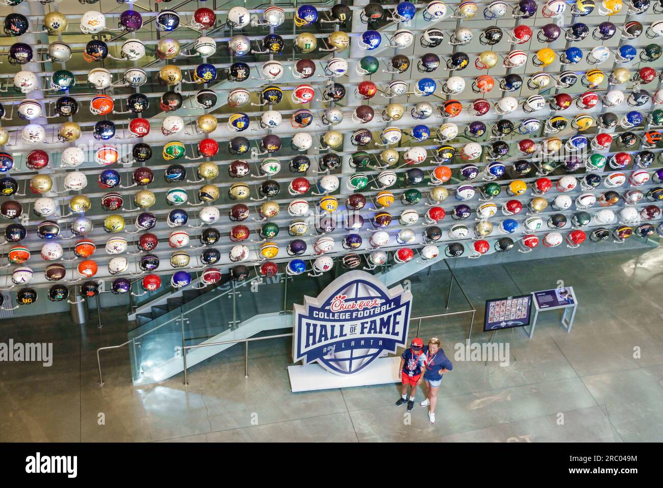 Atlanta Georgia,College Football Hall of Fame,team helmets helmet collection,Chick-fil-A corporate sponsor,inside interior indoors Stock Photo