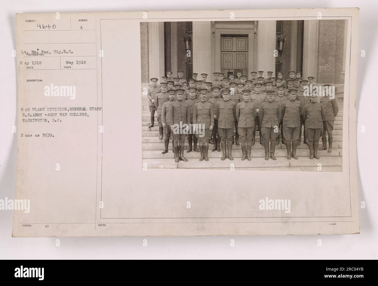 Image showing members of the War Plans Division, General Staff, U.S. Army, at the Army War College in Washington, D.C. The photograph was taken by Lieutenant Fox, Sig.R.C in May 1918. The photo is labeled as 111-SC-9640 and is also referred to as 3638. It depicts individuals taking notes during a meeting. Stock Photo