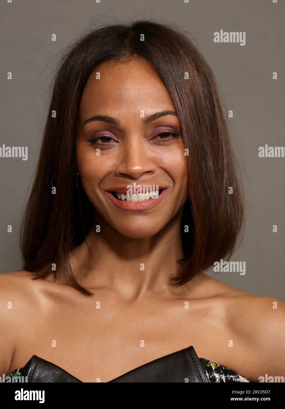 Zoe Saldana poses for photographers upon arrival at the premiere of the