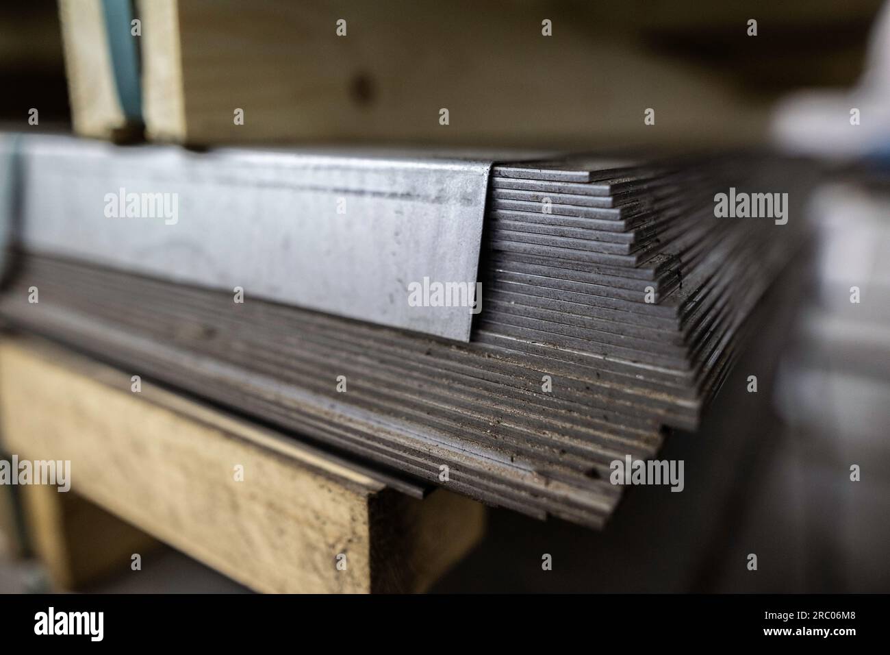 a stack of galvanized thick hot rolled steel sheets in a warehouse Stock Photo