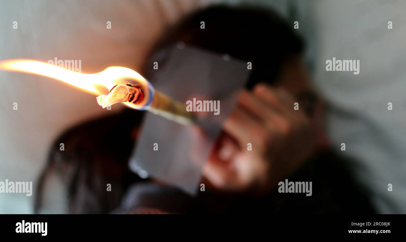 Ear candling self treatment burning candle for ear wax removal Stock