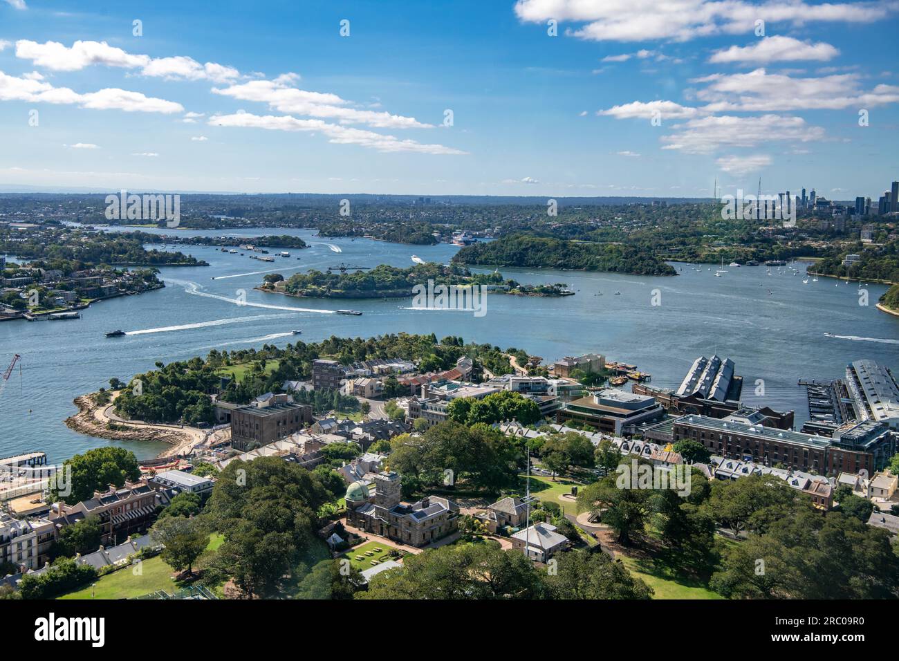 Aerial view Sydney Harbour looking North West with Garden Island and historic Rocks district in foreground Stock Photo