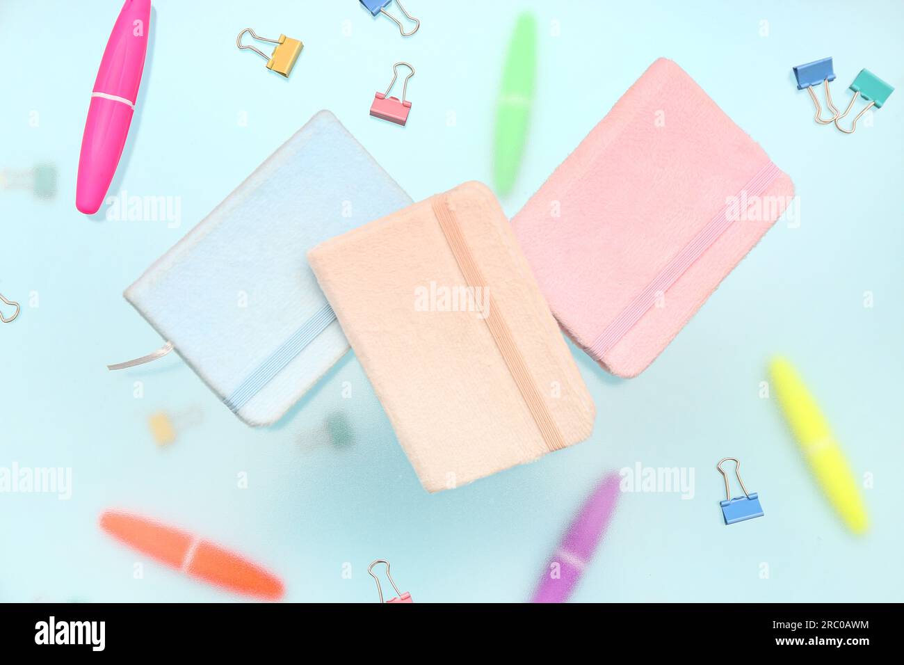 Notebooks with stationery on blue background Stock Photo