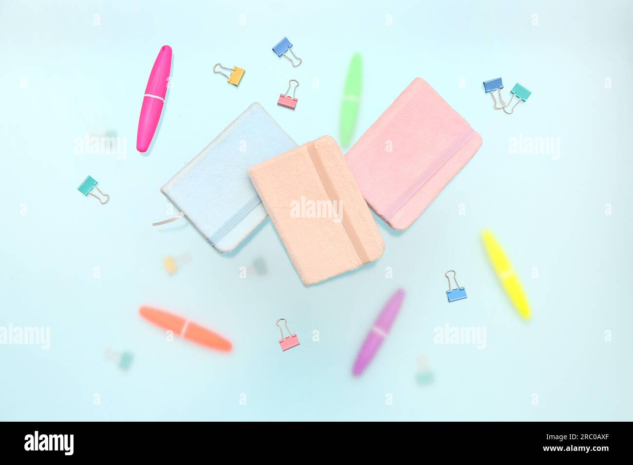 Notebooks with stationery on blue background Stock Photo