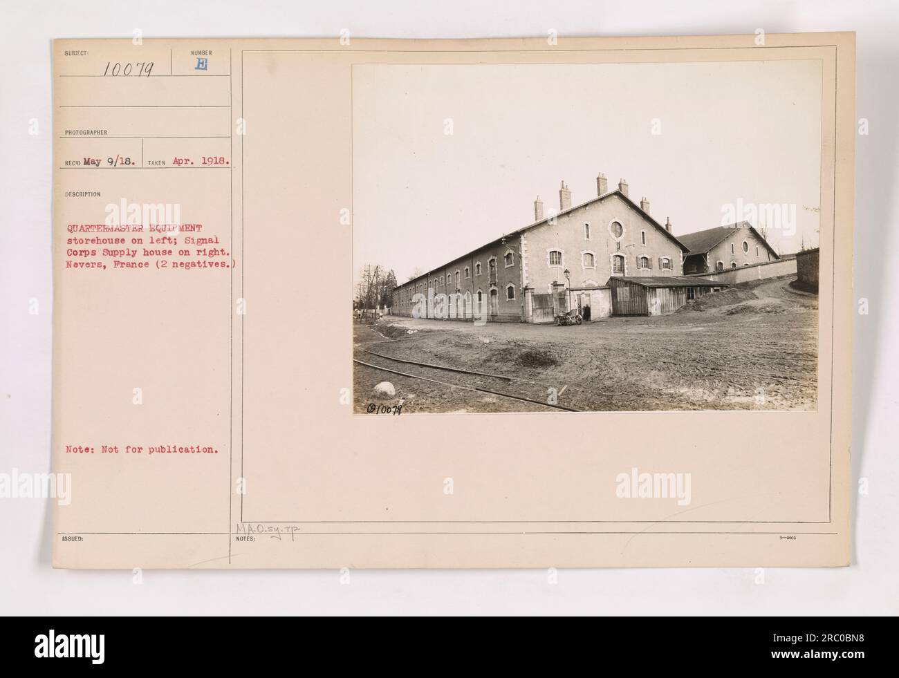 A view of the Quartermaster equipment storehouse on the left and the Signal Corps supply house on the right in Nevers, France. The photo was taken on May 9, 1918. Two negatives were used to capture the image. The caption indicates that the photo is not intended for publication. Stock Photo