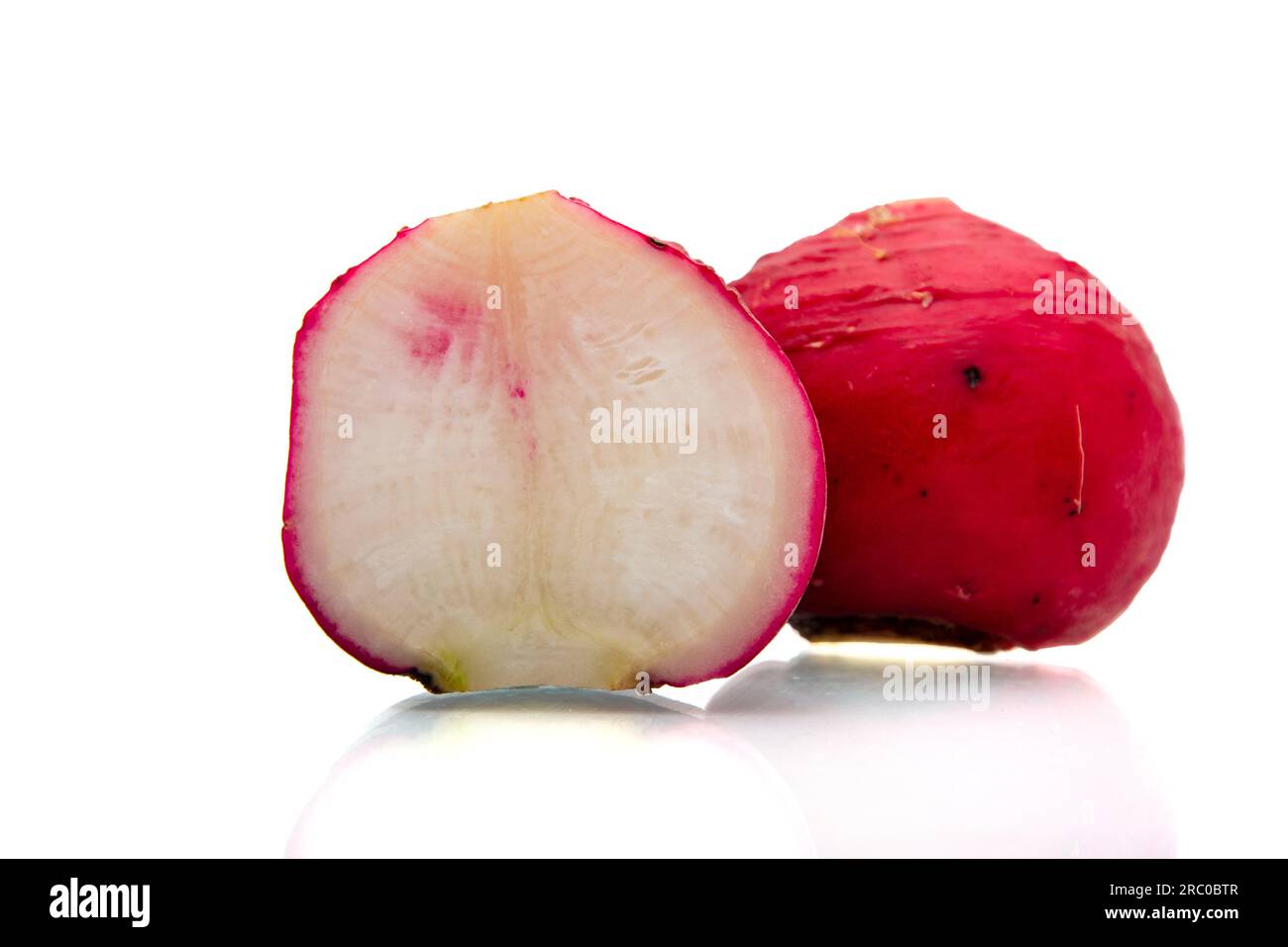 Radish cut in half closeup on white background Stock Photo Alamy