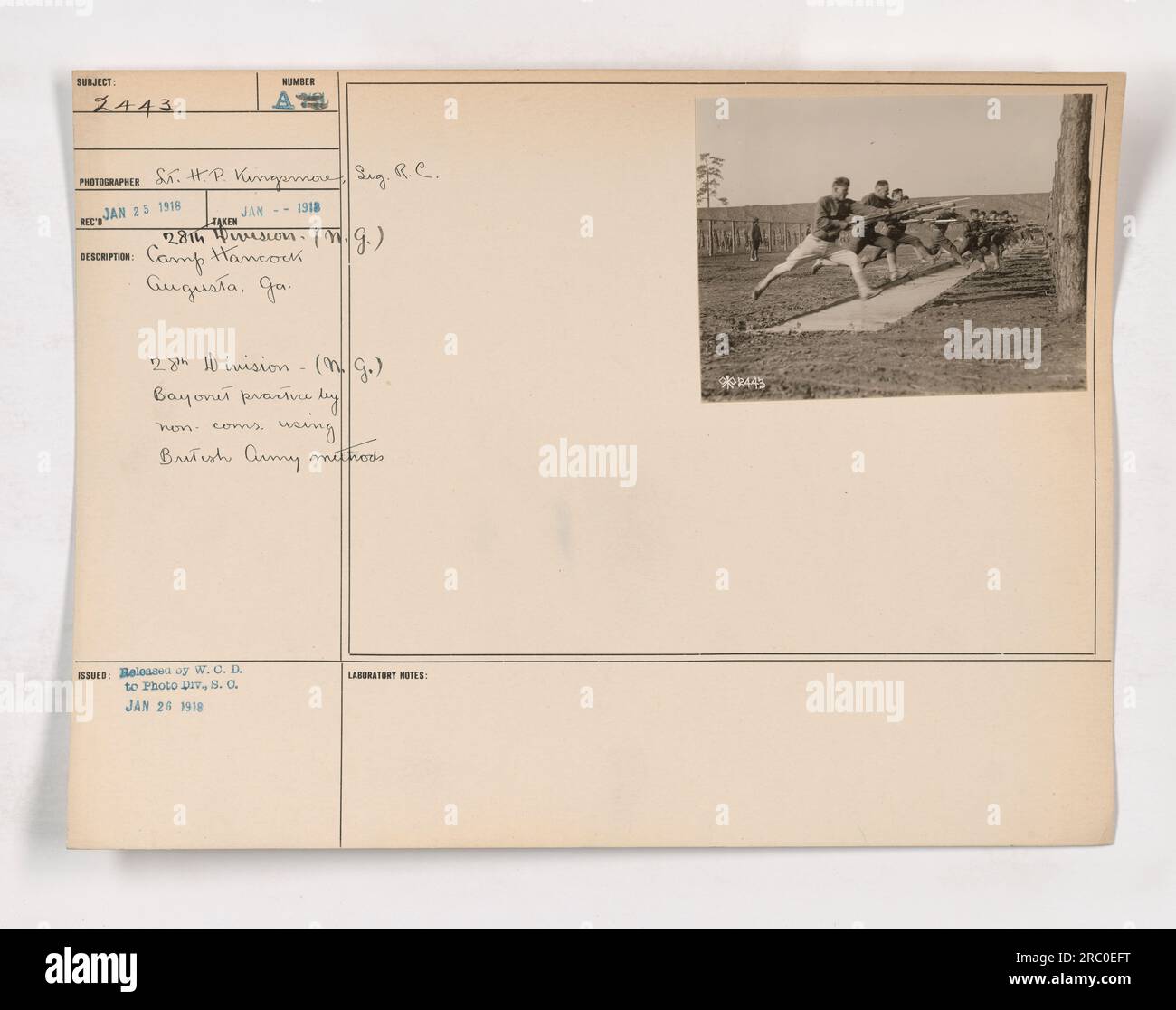 'Camp Hancock in Augusta, Georgia, features a bayonet practice session conducted by non-commissioned officers (NCOs) of the 28th Division (National Guard). The NCOs are utilizing British Army methods. The photograph, labeled 111-SC-2443, was taken on January 25, 1918, and released to the Photo Division on January 26, 1918.' Stock Photo