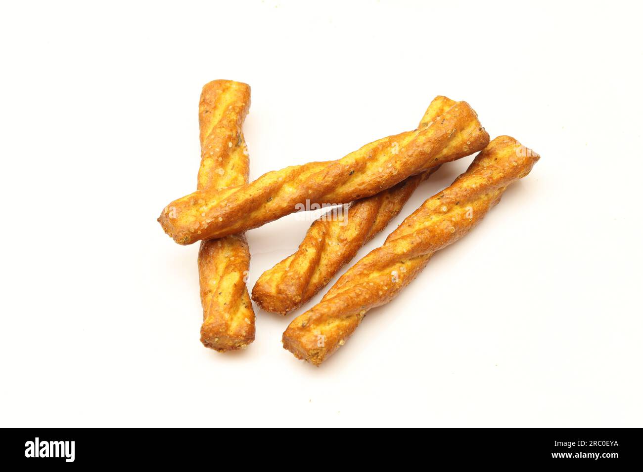 Few salty and  twisted pretzel sticks isolated on white background. Italian snack Stock Photo