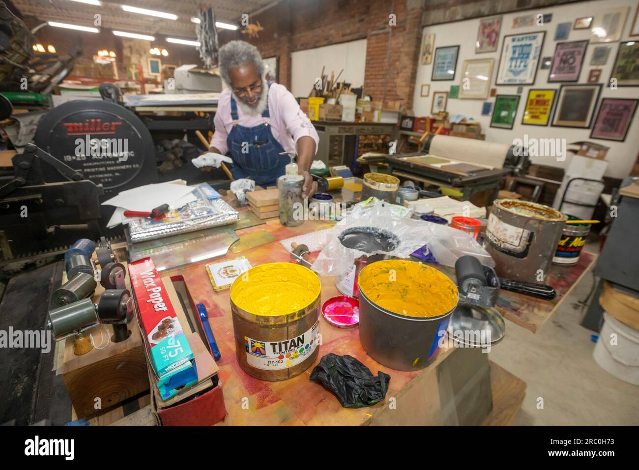 Detroit, Michigan - Amos Kennedy works in his letterpress printing shop. Kennedy prints posters and gives workshops on letterpress printing. Stock Photo