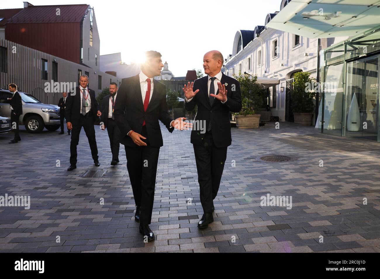 Vilnius, Lithuania. 11th July, 2023. British Prime Minister Rishi Sunak, left, chats with German Chancellor Olaf Schotz, right, as they walk together to the opening gala of the NATO Summit, July 11, 2023 in Vilnius, Lithuania. Credit: Simon Dawson/Simon Dawson/No 10 Downing Street/Alamy Live News Stock Photo
