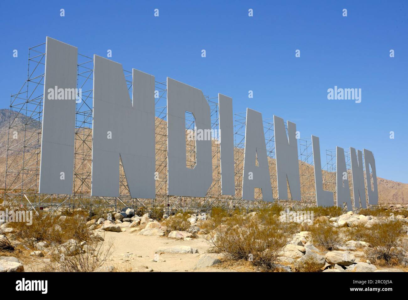 Palm Springs, California, USA. 20th Apr, 2021. The 45-foot letters of Never Forget reference the Hollywood sign, which initially spelled out HOLLYWOODLAND and was erected to promote a whites-only development. Artist Nicholas Galanin for Desert X 2021 (Credit Image: © Ian L. Sitren/ZUMA Press Wire) EDITORIAL USAGE ONLY! Not for Commercial USAGE! Stock Photo
