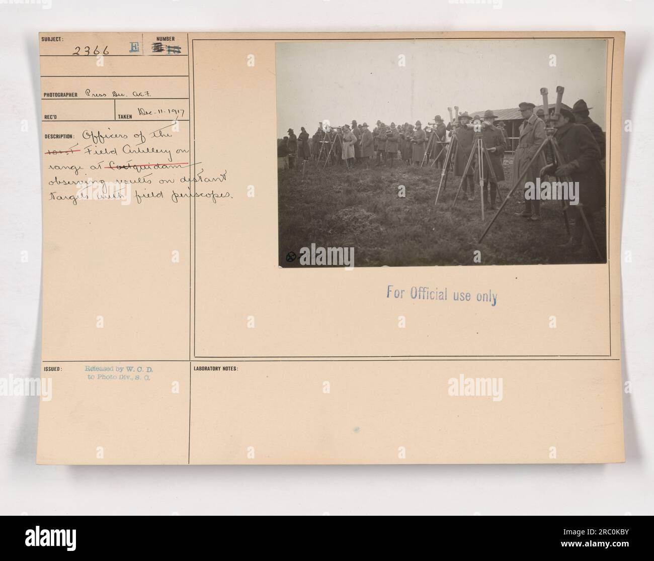 Officers of the --- Field Artillery in France observe the effect of shots fired from light field guns at distant targets, using field periscopes to determine new ranges. Photograph taken on November 11, 1917, and released by the War Office to the Photo Division for official use only. Stock Photo