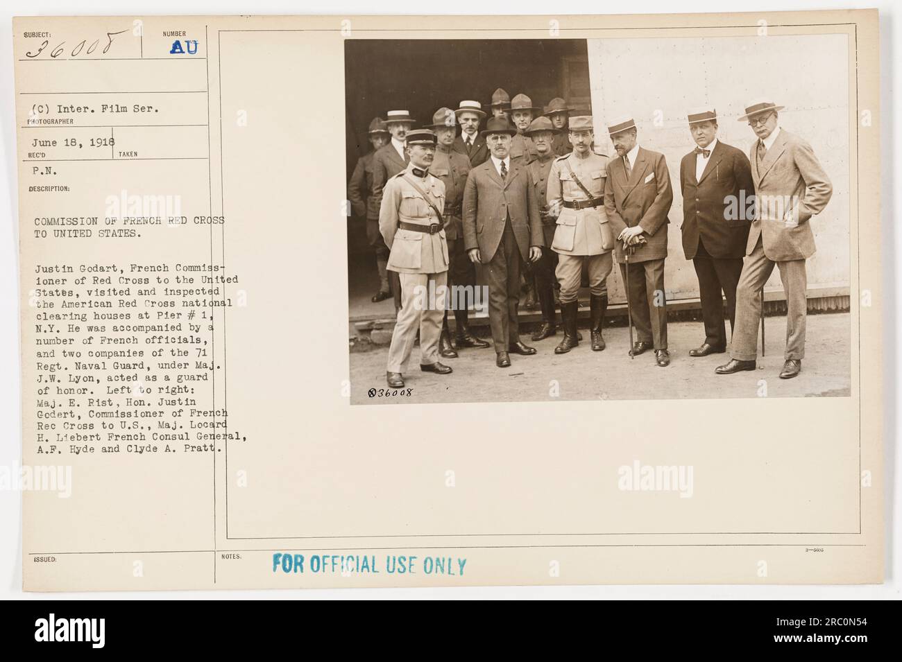 French Commissioner of Red Cross to the United States, Justin Godart, inspects American Red Cross national clearing houses at Pier # 1, NY. He is accompanied by French officials and a guard of honor from two companies of the 71st Regiment Naval Guard. Maj. E. Pist, Hon. Justin Godert (center), Maj. Looard H. Liebert, French Consul General, A.F. Hyde, and Clyde A. Pratt are pictured. Stock Photo