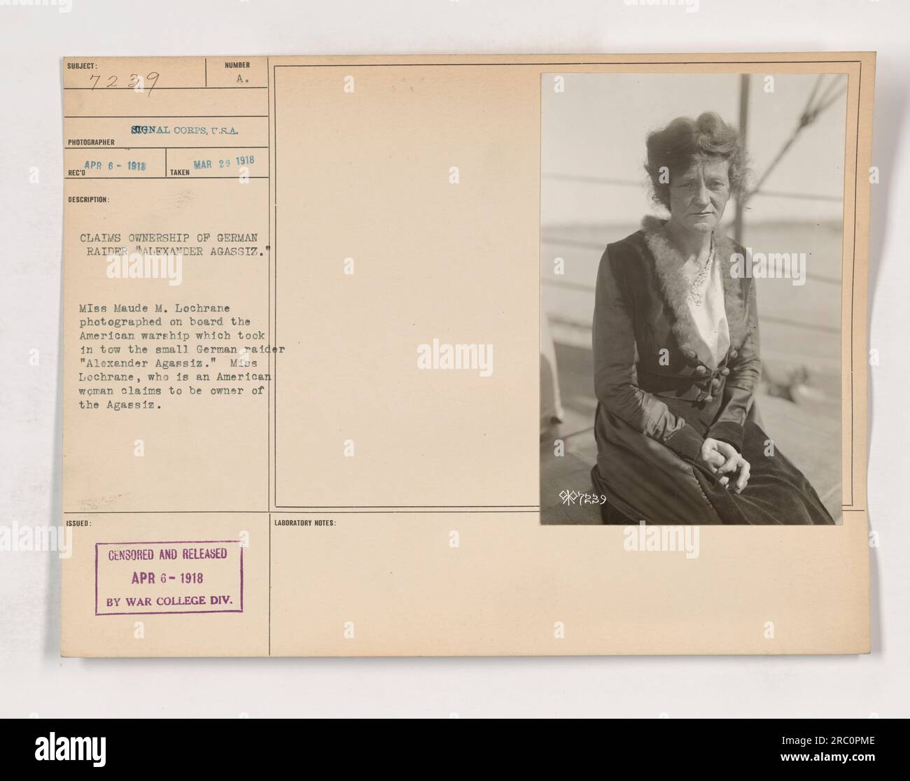 The photograph depicts Miss Maude M. Lochrane onboard an American warship that was towing the small German raider, 'Alexander Agassiz.' Miss Lochrane, an American woman, claims ownership of the Agassiz. The photo was censored and released on April 6, 1918, by the War College Division Laboratory. The photographer is Hinder A. Signal Corps. Stock Photo
