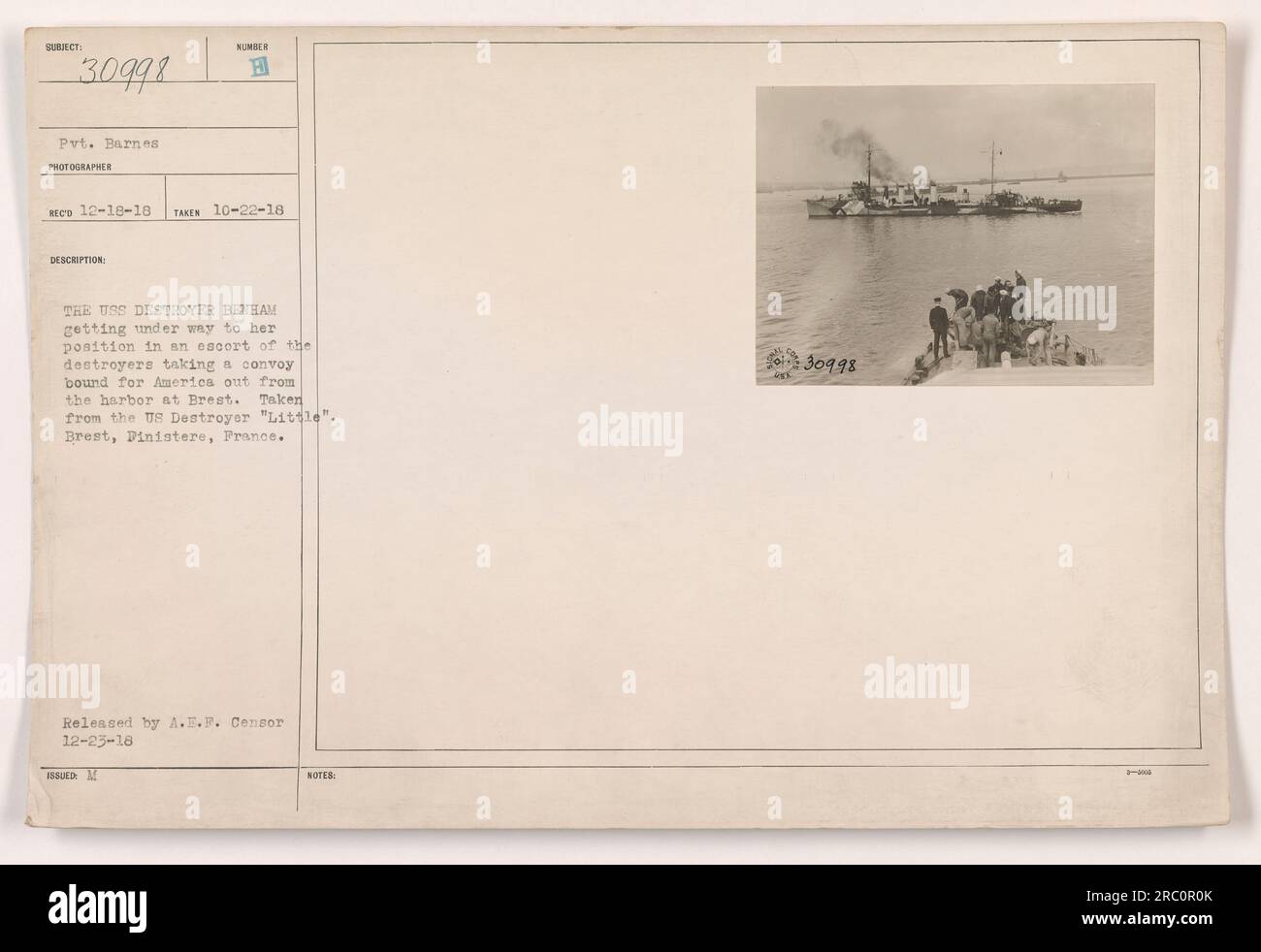 Caption: 'Private Barnes captured this photograph of the USS Destroyer Benham leaving Brest harbor in France. The ship was part of a convoy escorting ships bound for America during World War I. The image was taken from the US Destroyer 'Little' and released by the A.E.F. Censor on December 25, 1918.' Stock Photo