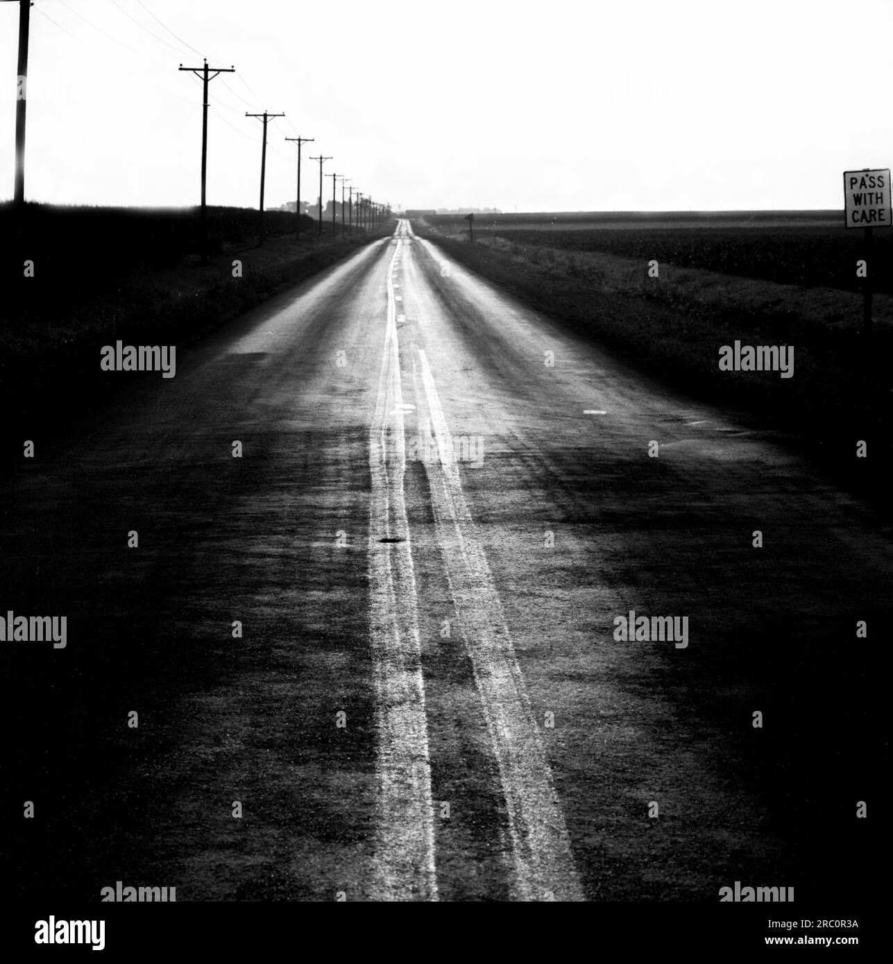 deserted two lane blacktop country road Stock Photo