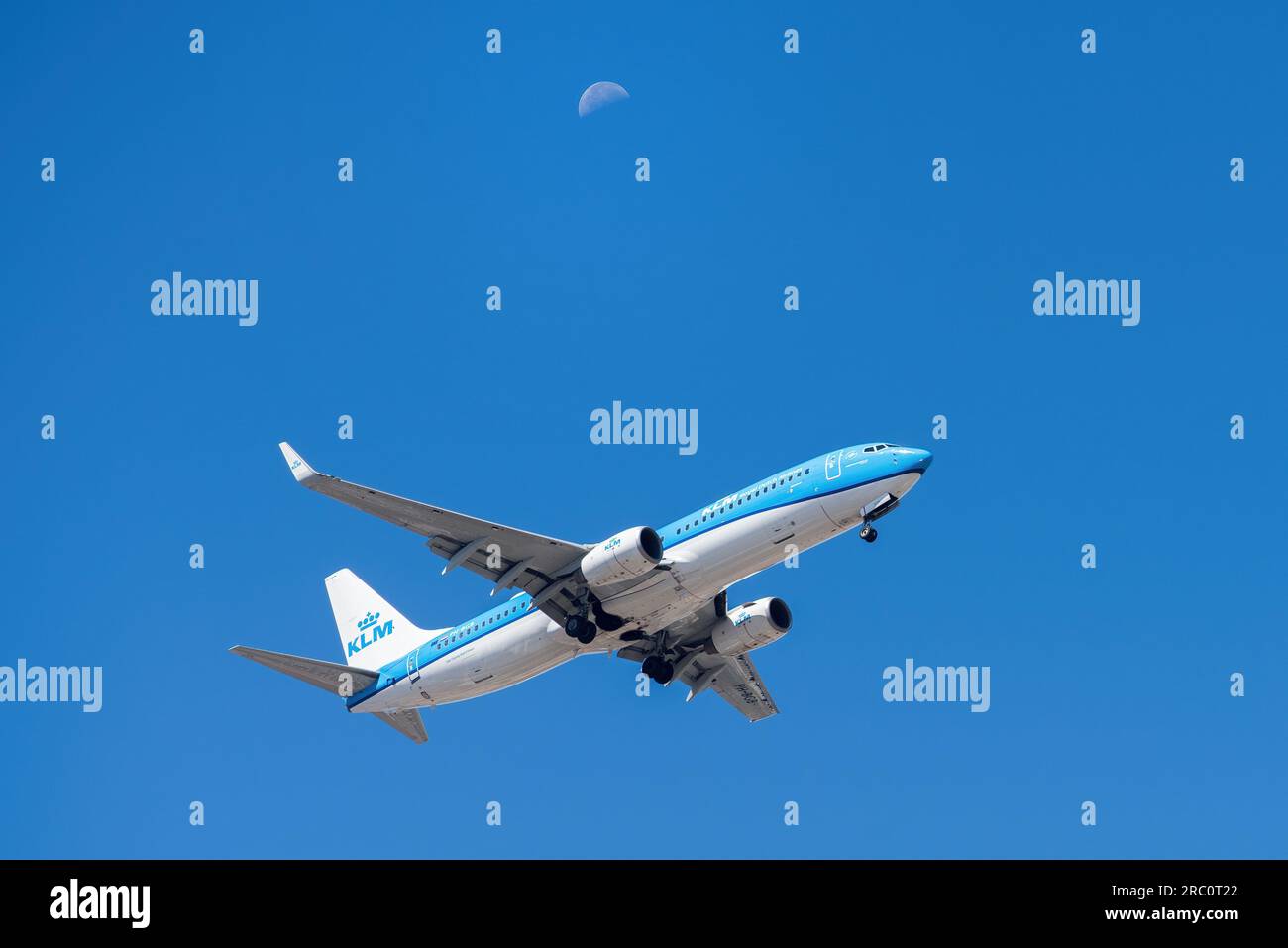 Lisbon, Portugal - July 12, 2023: Dutch company KLM with aircraft Boeing 737-8K2 approaching to land at Lisbon International Airport against blue sky Stock Photo