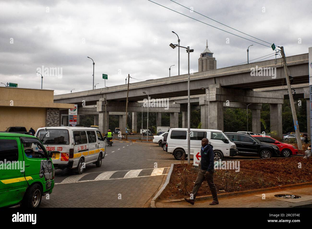 Motorists drive past the new Nairobi Expressway at the Central Business District (C.B.D) in Nairobi. Day-to-day life through the streets of Nairobi City well known as a City under the sun deprived from the Maasai word Enkare which translates to 'place of cool waters'. Nairobi is the largest and Kenya’s capital City. Stock Photo