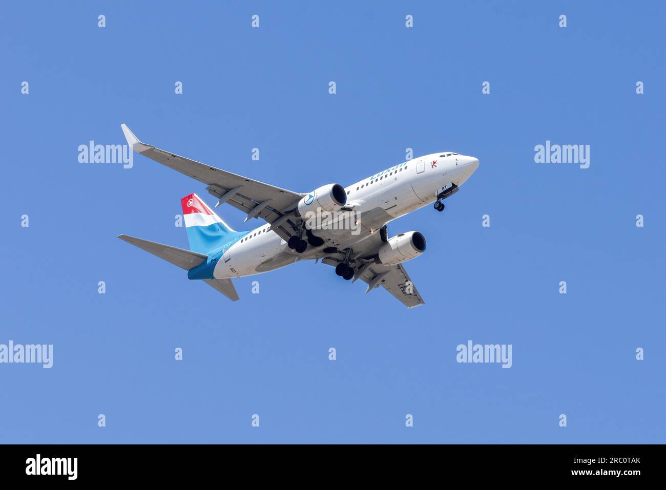 Lisbon, Portugal - July 12, 2023: Luxembourg air company Luxair with aircraft Boeing 737-7K2 approaching to land at Lisbon International Airport Stock Photo