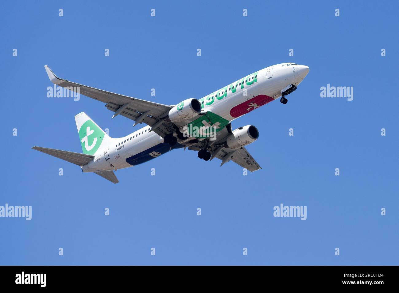 Lisbon, Portugal - July 12, 2023: Dutch based Transavia air company with aircraft Boeing 737-8GJ approaching to land at Lisbon International Airport Stock Photo