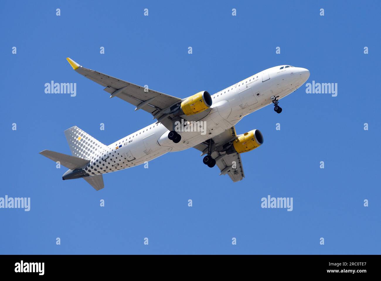 Lisbon, Portugal - July 12, 2023: German Vueling air company with aircraft Airbus A320 approaching to land at Lisbon International Airport against Stock Photo