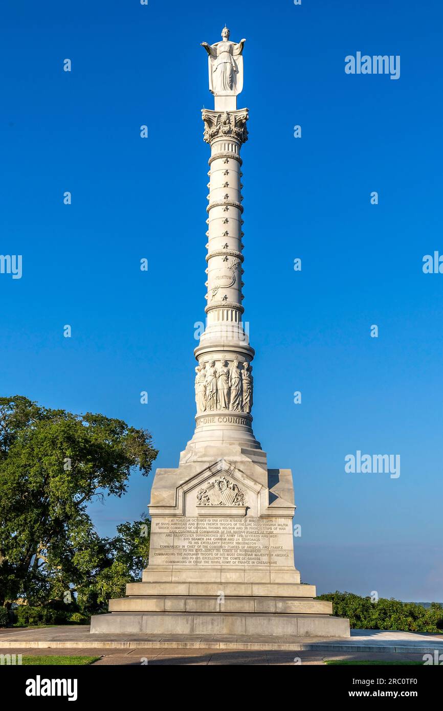 Yorktown victory monument authorized in 1789, completed in 1889 and liberty statue replaced in 1956 after a kightning strike. Shaft is made from Maine Stock Photo