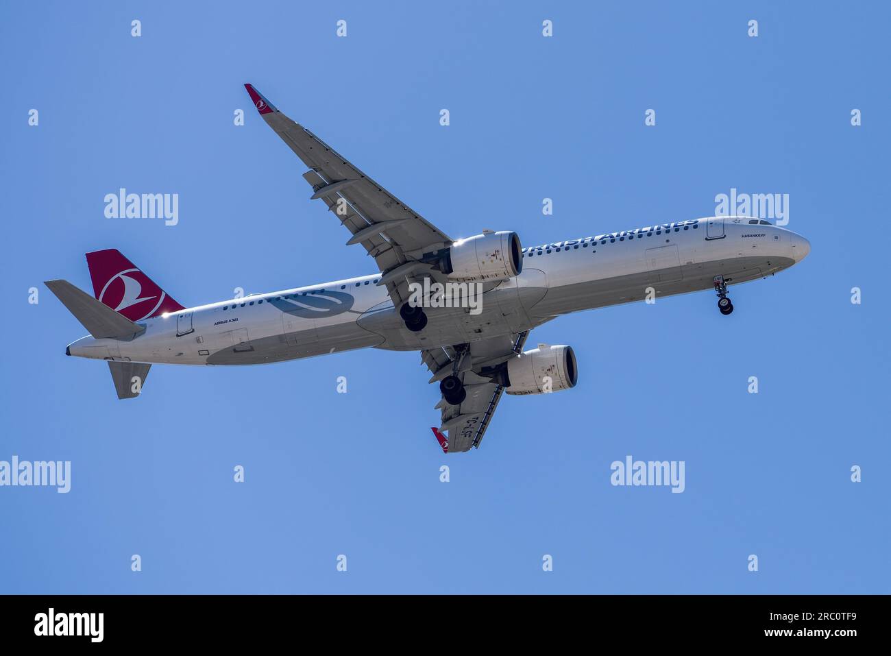 Lisbon, Portugal - July 12, 2023: Turkish Airlines with aircraft Airbus A321 approaching to land at Lisbon International Airport against blue sky Stock Photo