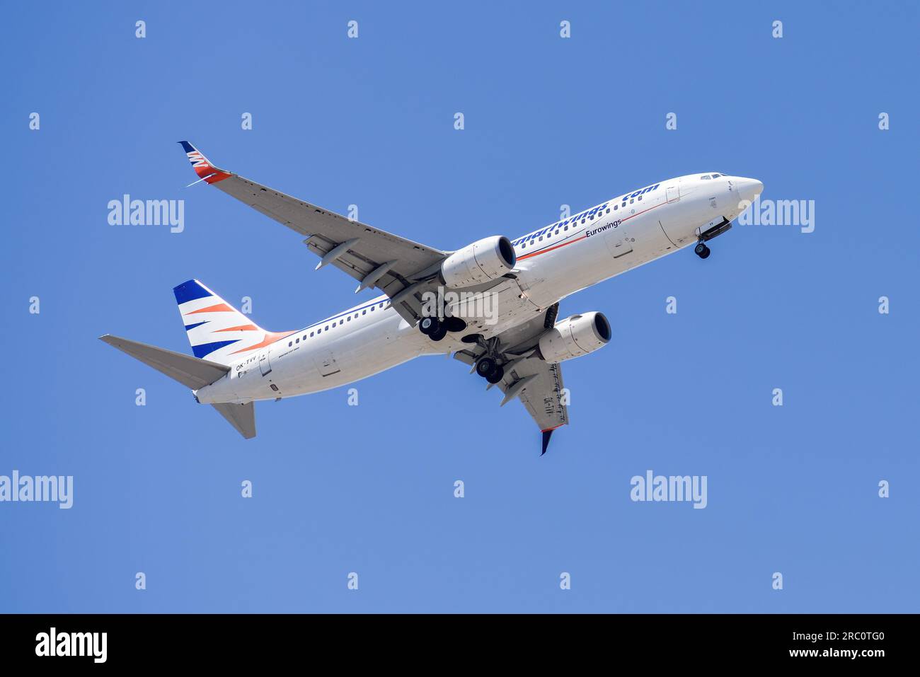 Lisbon, Portugal - July 12, 2023: Smartwings air company with aircraft Boeing 737-800 approaching to land at Lisbon International Airport against blue Stock Photo