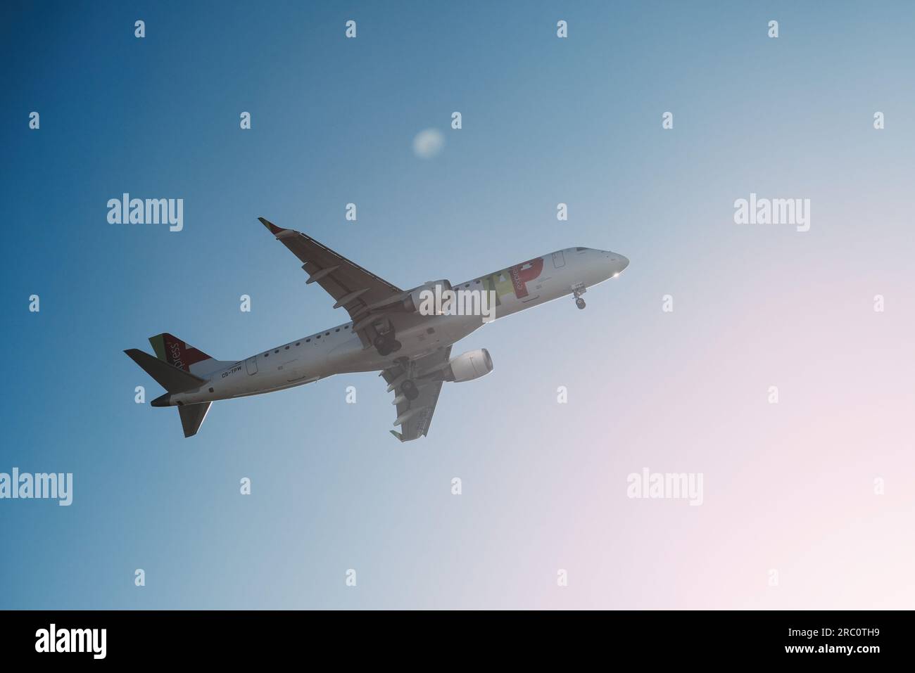 Lisbon, Portugal - July 12, 2023: Portuguese company Tap with aircraft Airbus A321-253NX approaching to land at Lisbon International Airport against Stock Photo