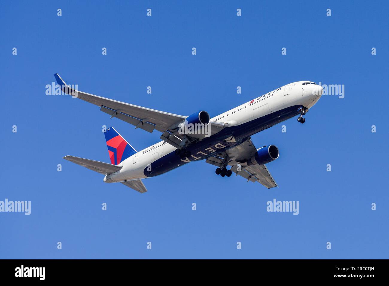 Lisbon, Portugal - July 12, 2023: United States air company Delta Airlines with aircraft Boeing 767-332 approaching to land at Lisbon International Stock Photo