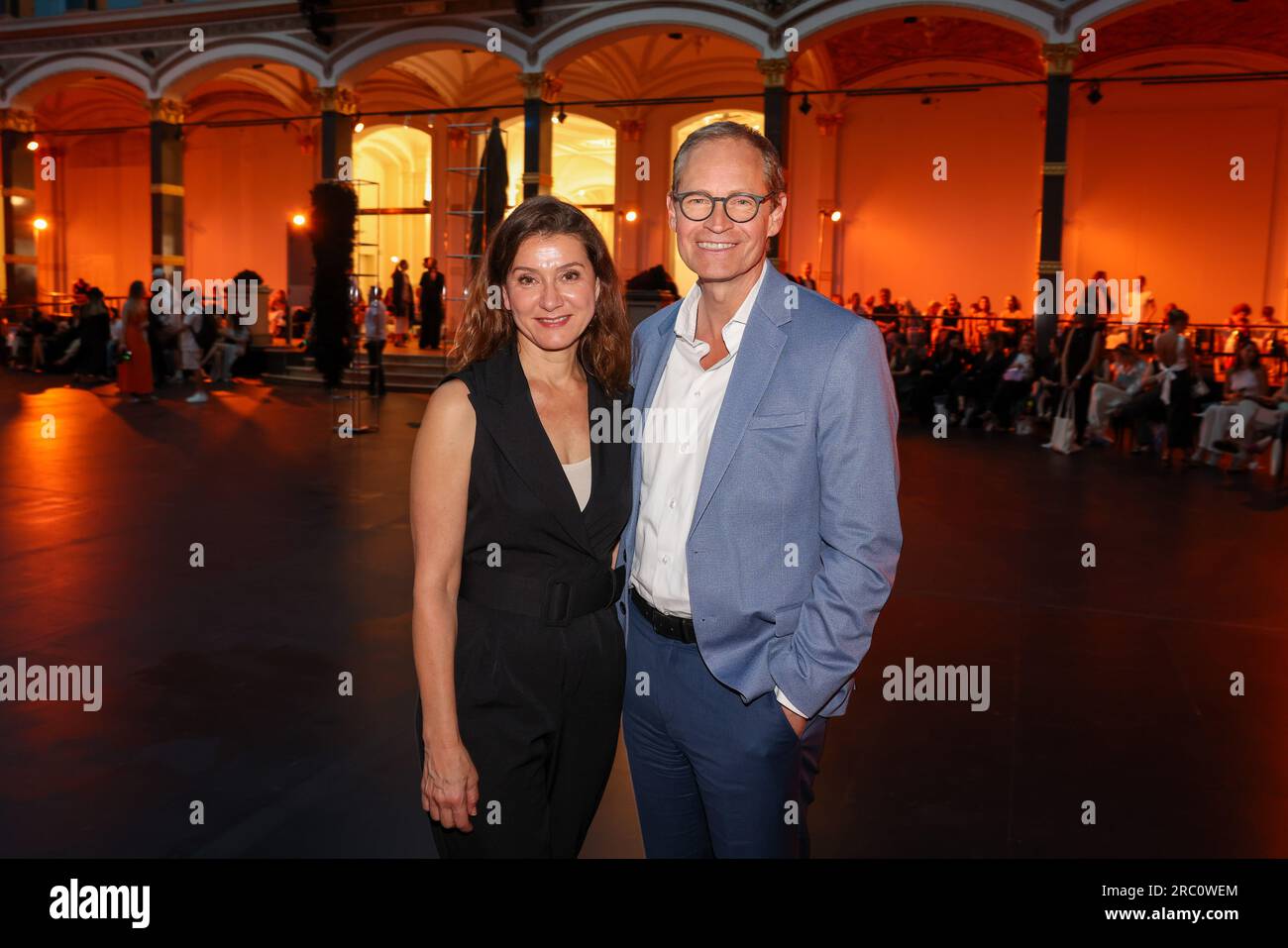 Berlin, Germany. 11th July, 2023. Michael Müller and Reyhan Sahin attend the fashion show of the label 'William Fan' at the Gropius Bau during Berlin Fashion Week. Handbags made from recycled shoes, cashmere in summer and lots of denim - Fashion Week focuses on sustainability. Credit: Gerald Matzka/dpa/Alamy Live News Stock Photo