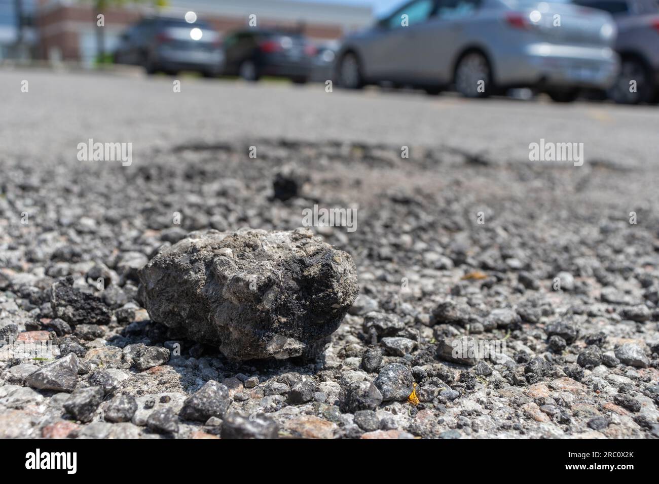 Small rock on road - rough texture close up background. Taken in ...