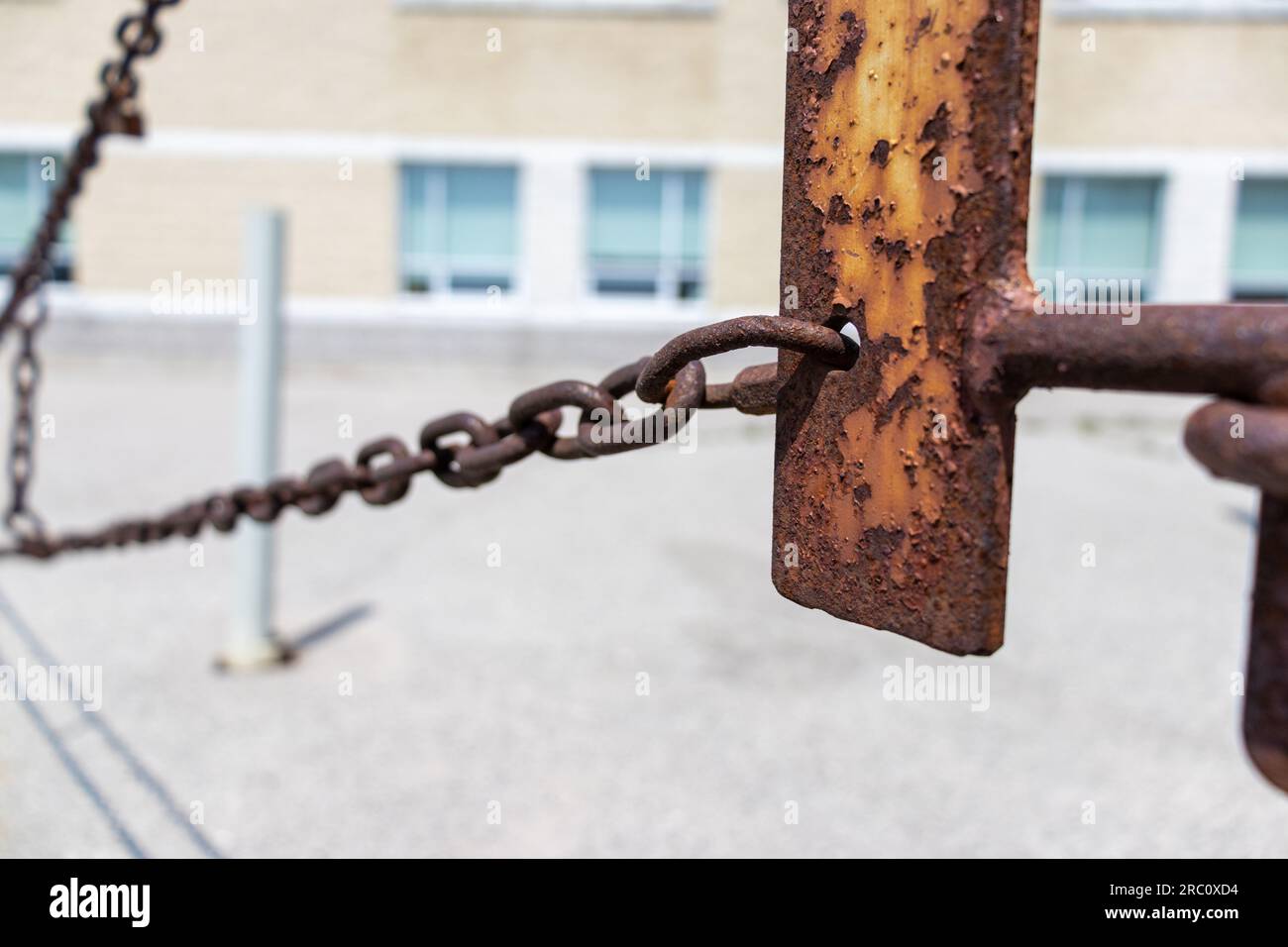 Rusted metal chain fence gate - blurred background. Taken in Toronto, Canada. Stock Photo