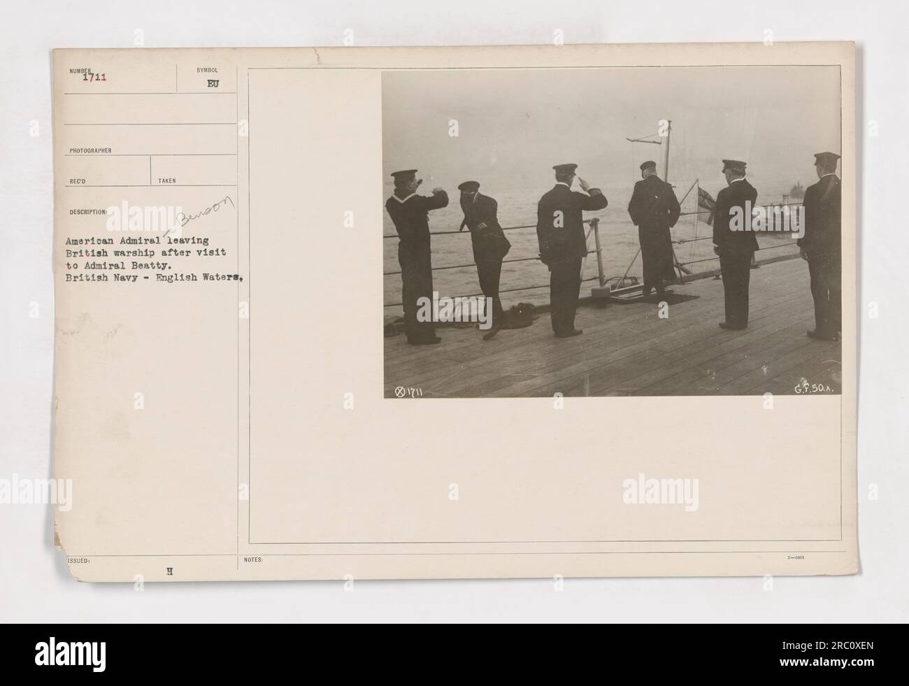 Admiral Benson boarding his ship after visiting the British flagship in English waters during World War One. The photo, taken by an American photographer, shows the exchange of information and coordination between the American and British navies. Benson is seen leaving the British warship after meeting with Admiral Beatty. Stock Photo