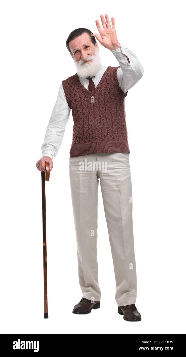 Senior man with walking cane waving on white background Stock Photo - Alamy