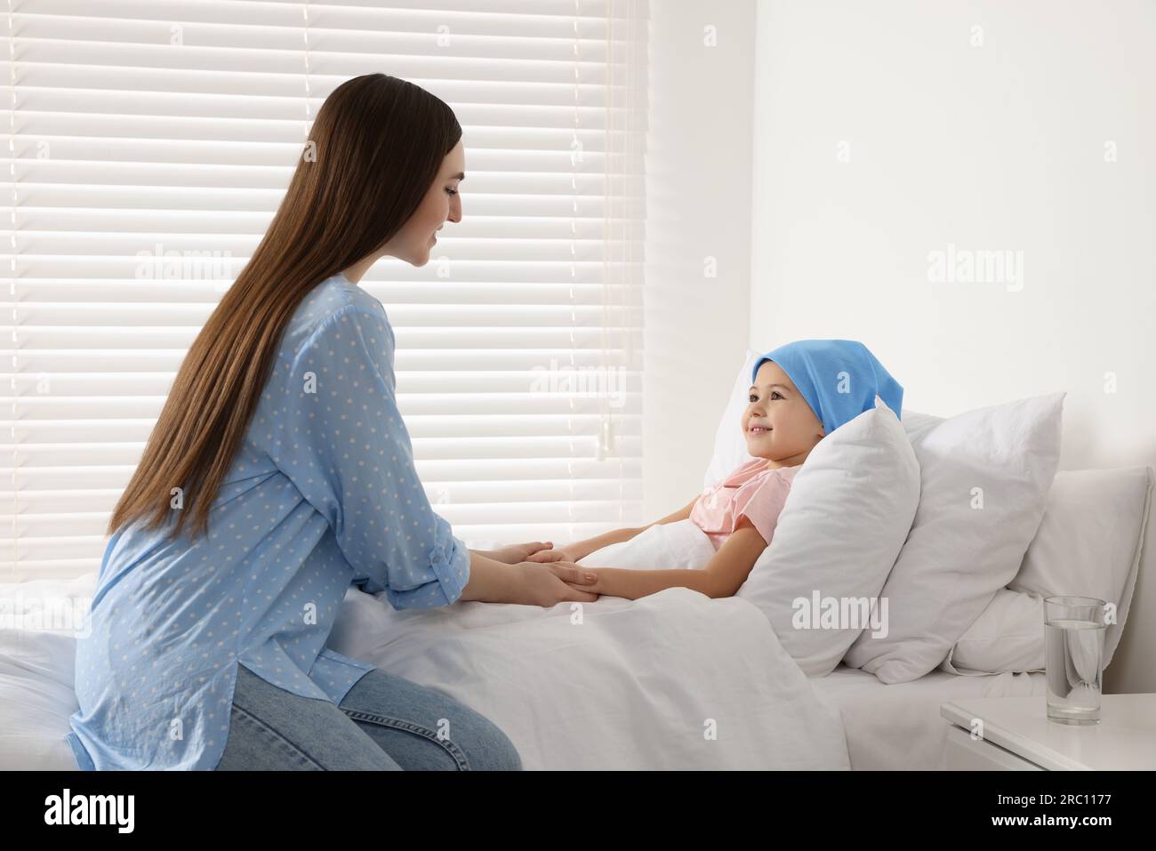 Childhood cancer. Mother and daughter in hospital Stock Photo