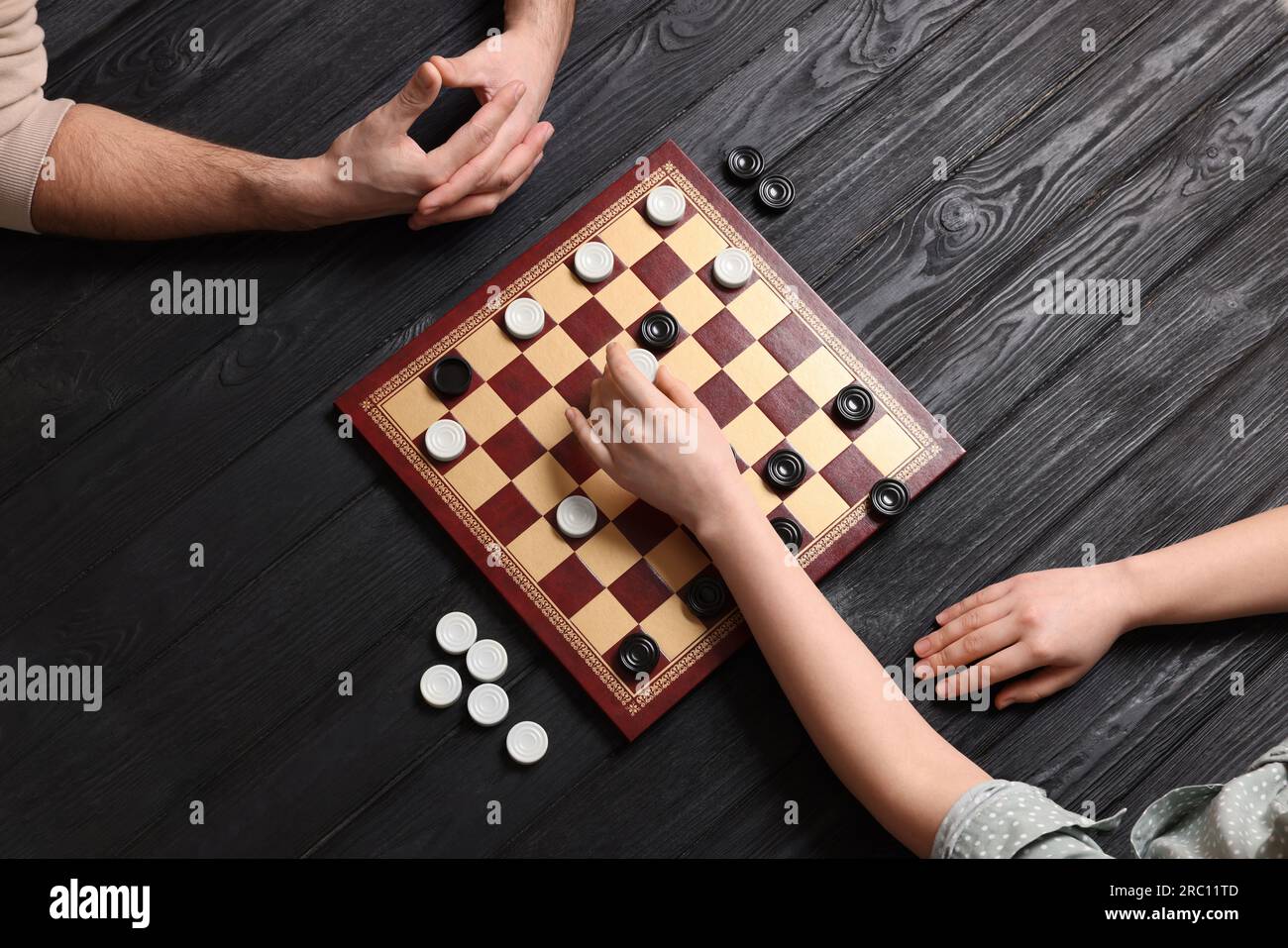 Premium Photo  Twin brothers playing chess isolated on white