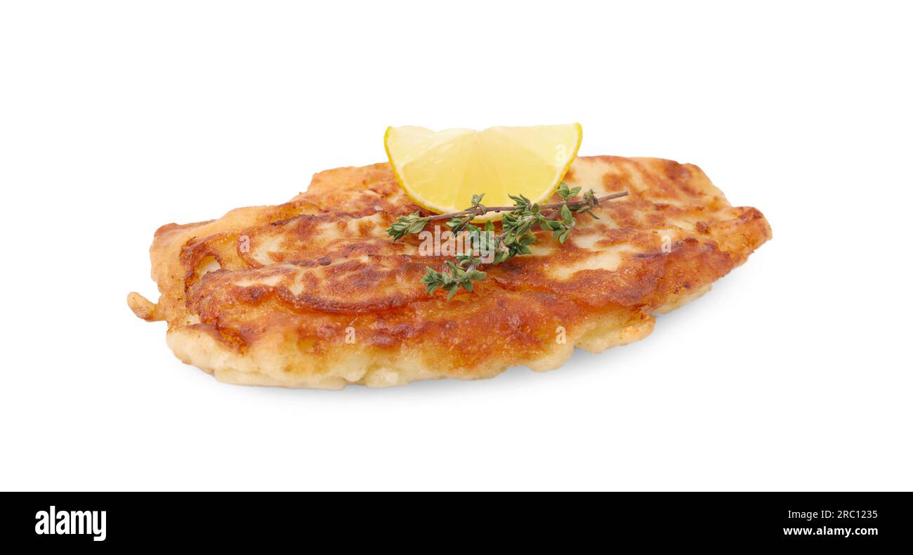 Tasty fish in soda water batter, thyme and lemon slice isolated on