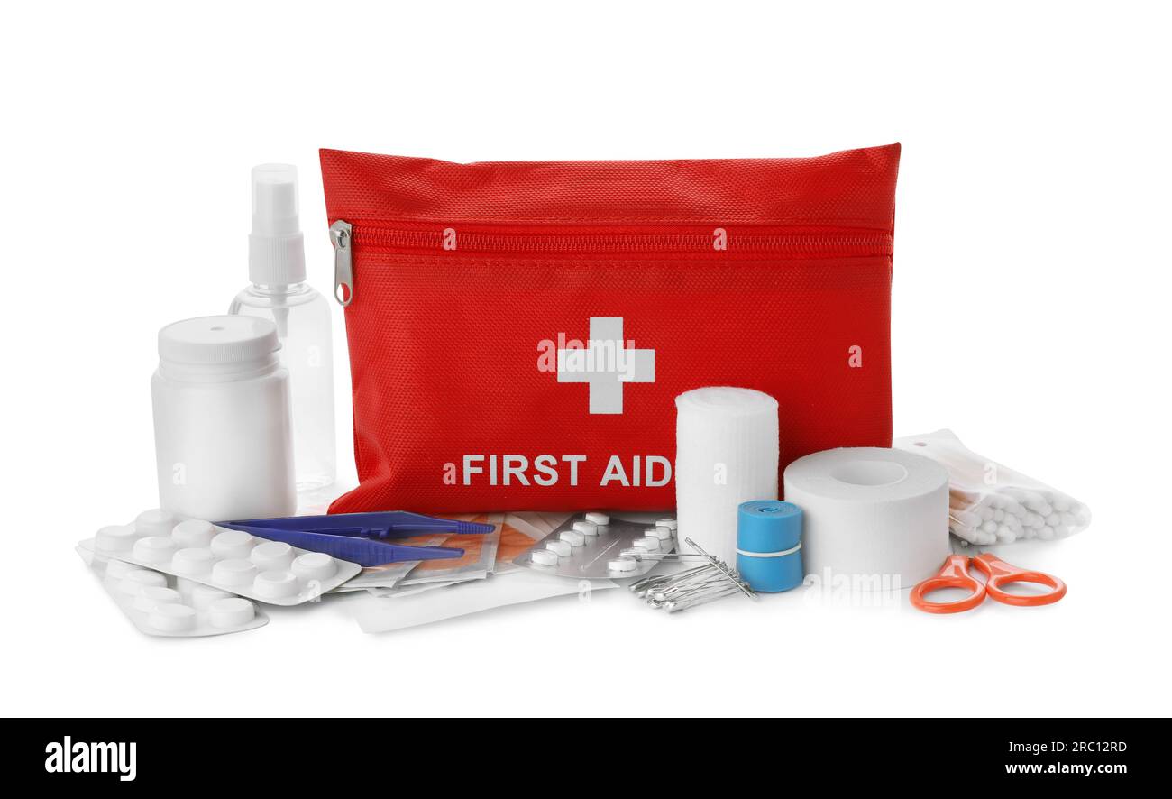 Red first aid kit, scissors, pins, cotton buds, pills, plastic forceps